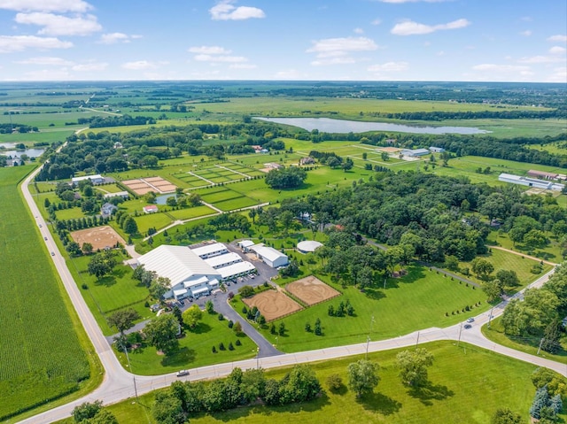 birds eye view of property featuring a water view and a rural view