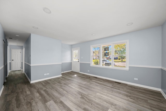 spare room with dark wood-type flooring