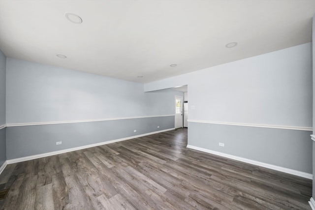 spare room featuring dark hardwood / wood-style flooring