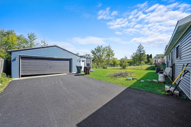 garage featuring a yard