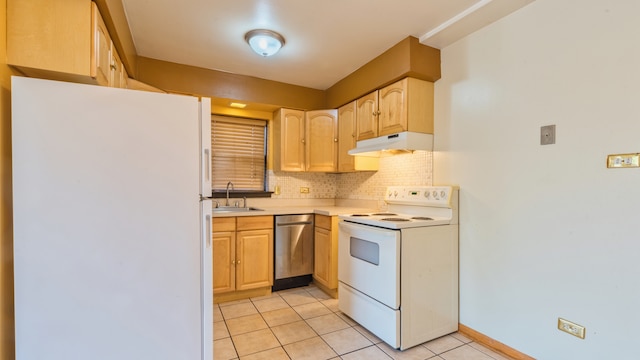 kitchen featuring light brown cabinetry, sink, white appliances, and light tile patterned flooring