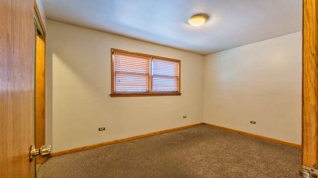 empty room with carpet flooring