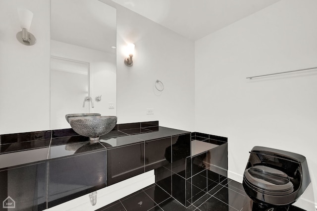 bathroom with vanity, toilet, and tile patterned flooring