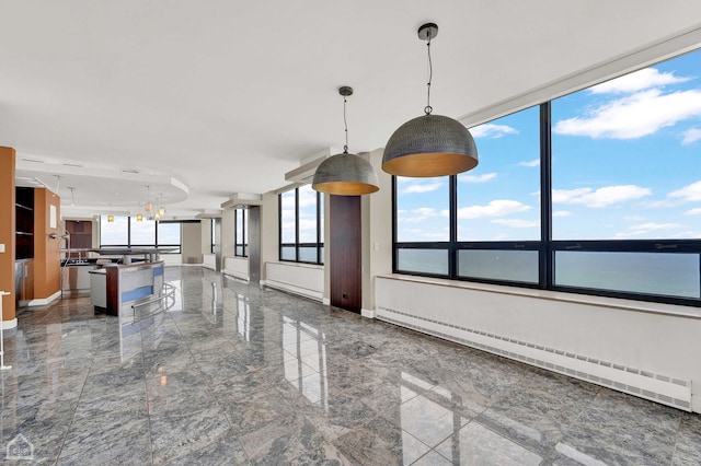 interior space with a baseboard heating unit, a water view, and a chandelier