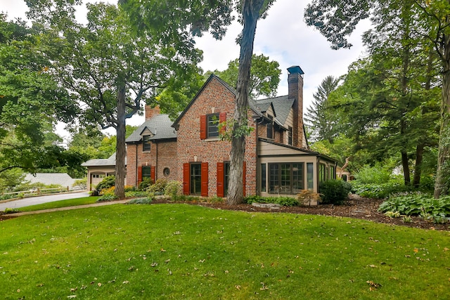 view of front of home with a garage and a front yard