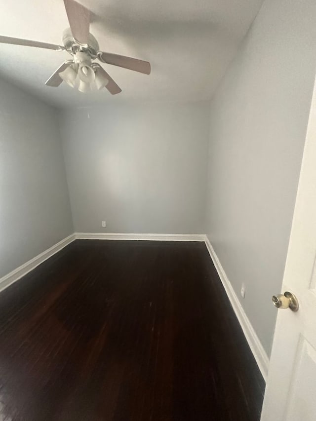 spare room with wood-type flooring and ceiling fan