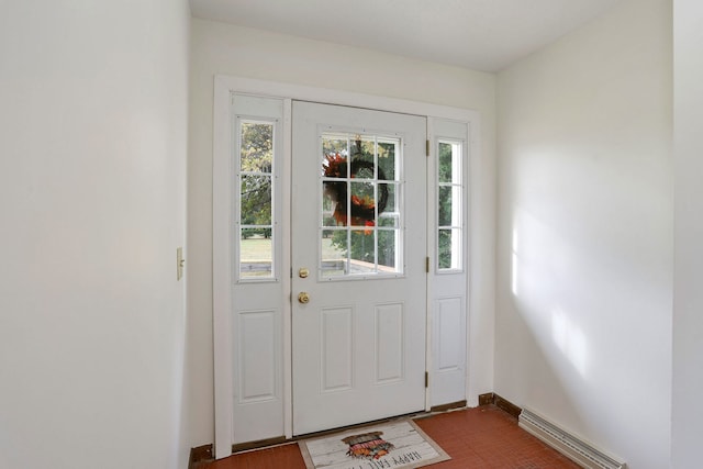 doorway featuring a baseboard heating unit