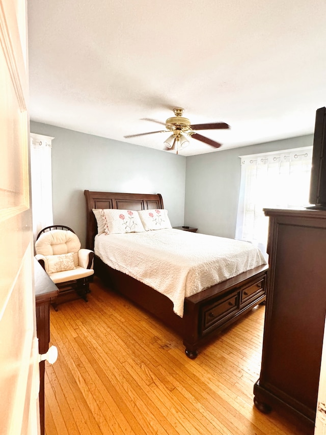 bedroom featuring ceiling fan and light wood-type flooring