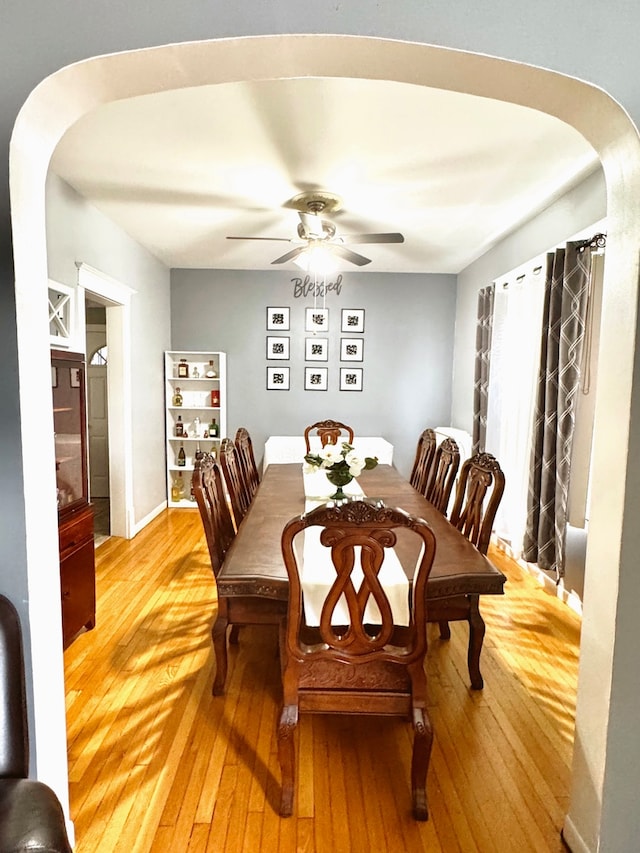 dining area featuring ceiling fan and hardwood / wood-style flooring