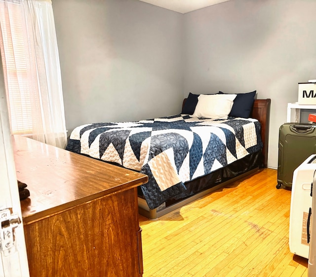 bedroom with light hardwood / wood-style floors