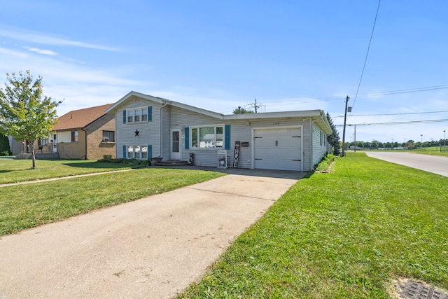 ranch-style home with a front lawn and a garage