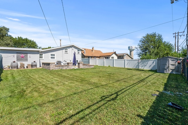 view of yard with a shed and a patio