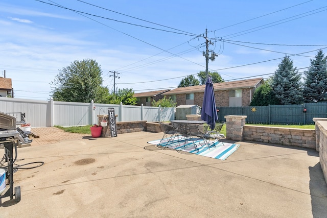 view of patio featuring a fenced backyard and outdoor dining space