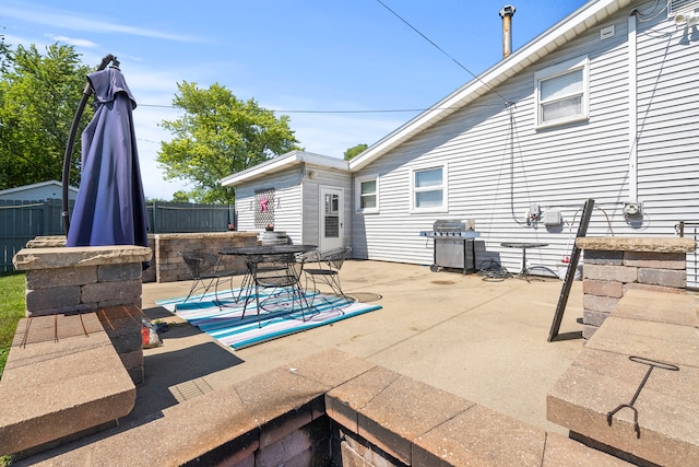 view of patio featuring a grill