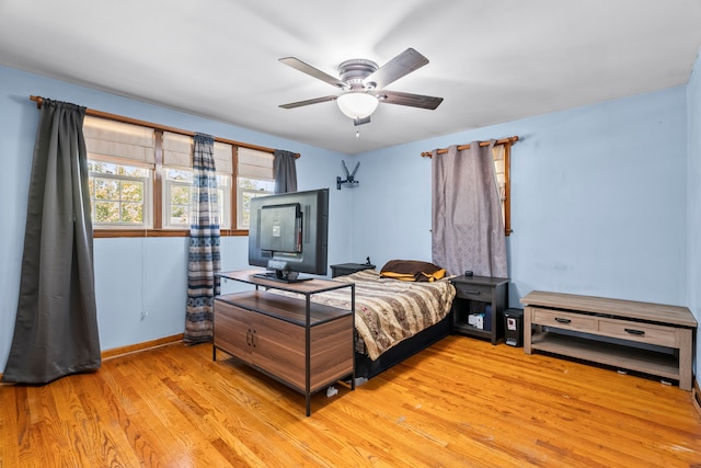 bedroom featuring ceiling fan and light hardwood / wood-style floors