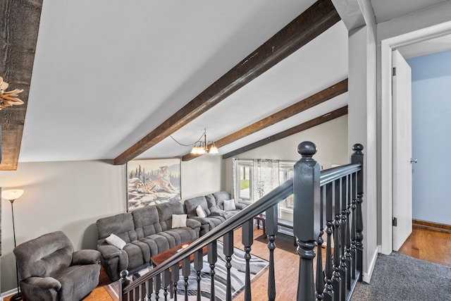 interior space with lofted ceiling with beams, hardwood / wood-style flooring, and a chandelier