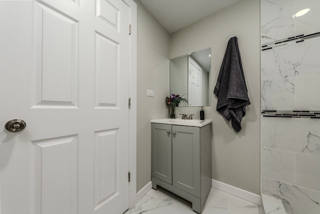 bathroom with vanity and tiled shower