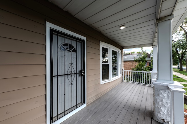 wooden terrace featuring a porch