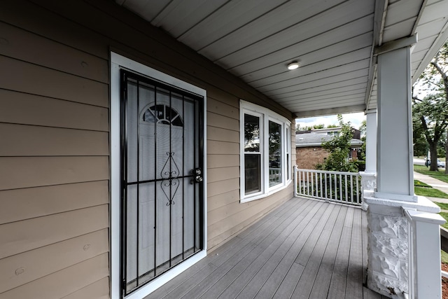 wooden terrace with a porch