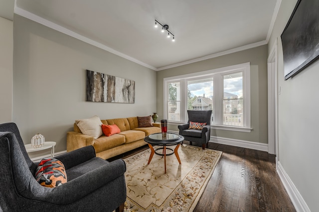 living room featuring track lighting, dark hardwood / wood-style flooring, and crown molding