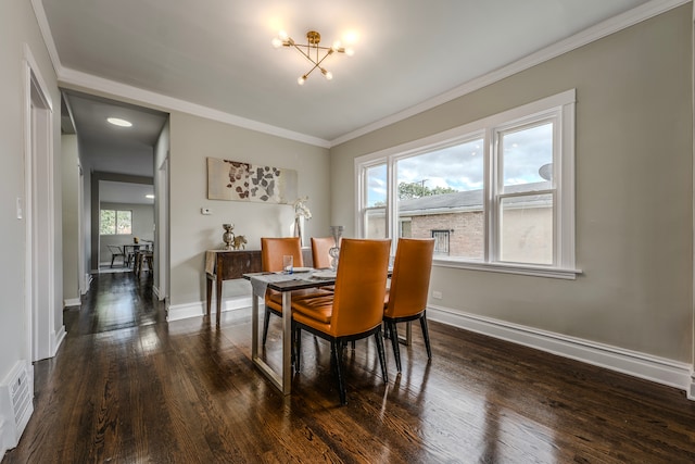 dining space featuring ornamental molding and dark hardwood / wood-style floors