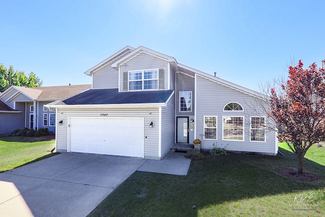 view of front of home featuring a garage and a front yard