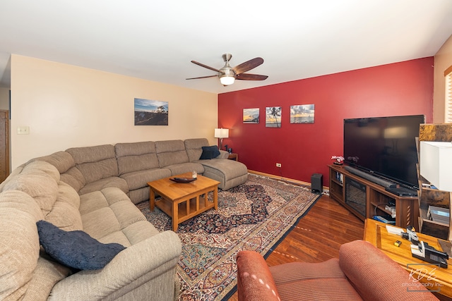 living room featuring dark hardwood / wood-style floors and ceiling fan