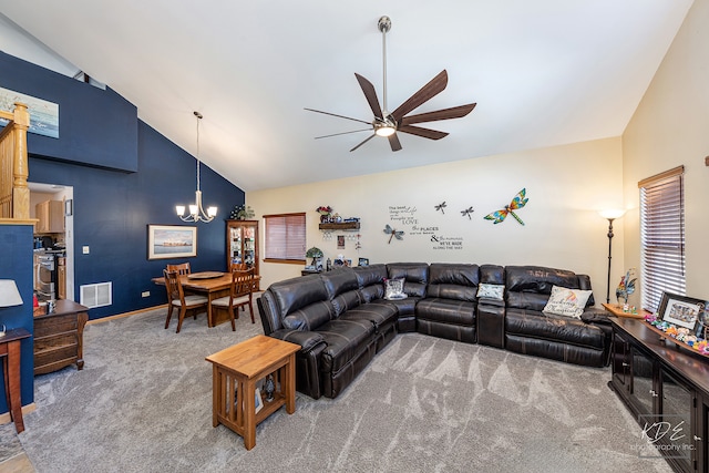 living room featuring ceiling fan with notable chandelier, high vaulted ceiling, and carpet flooring