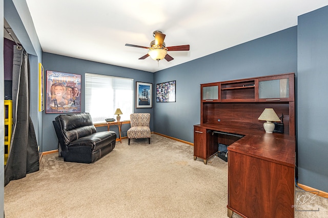 home office with light carpet and ceiling fan