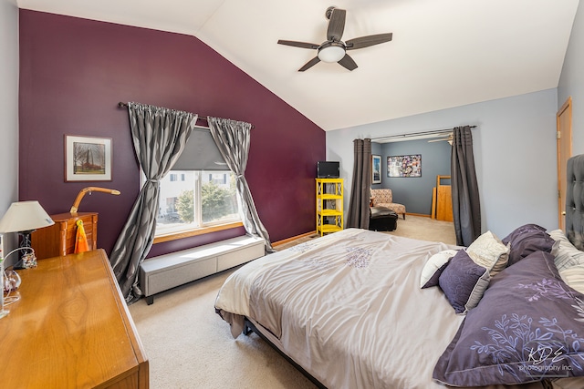 carpeted bedroom with ceiling fan and lofted ceiling