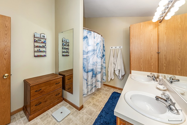 bathroom featuring lofted ceiling, vanity, and tile patterned floors