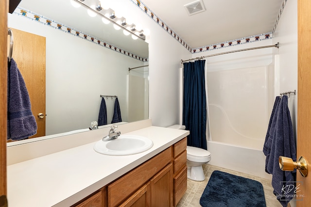 full bathroom featuring shower / tub combo, vanity, and toilet