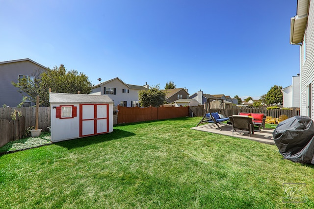 view of yard featuring a patio area and a shed