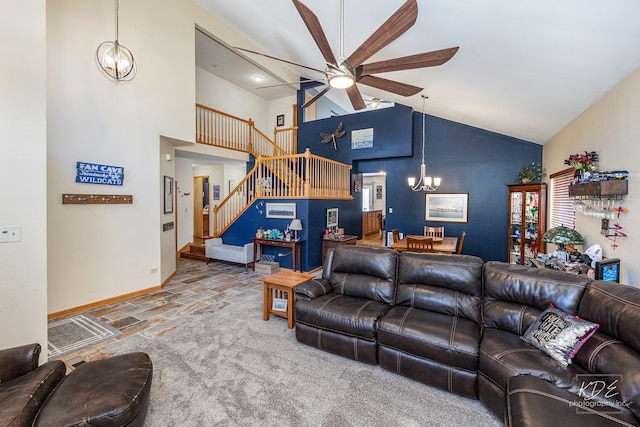 living room featuring ceiling fan with notable chandelier and high vaulted ceiling