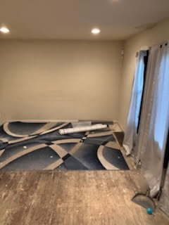 miscellaneous room with recessed lighting and wood finished floors