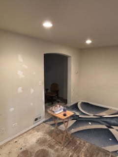 interior space featuring recessed lighting and baseboards