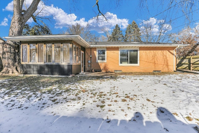 view of front of property featuring a sunroom