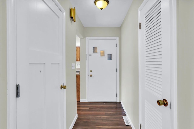 hall with dark hardwood / wood-style floors