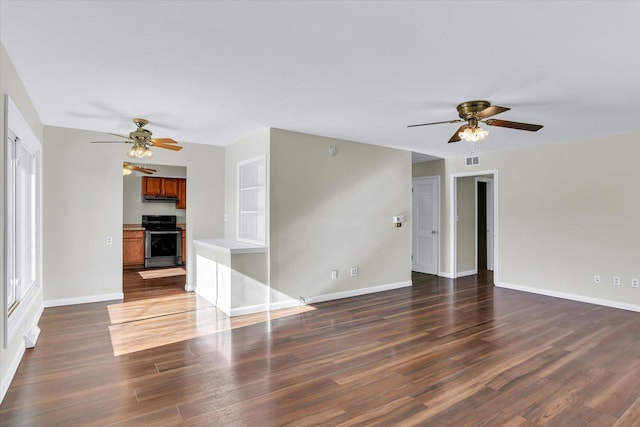 unfurnished living room with dark hardwood / wood-style floors and ceiling fan