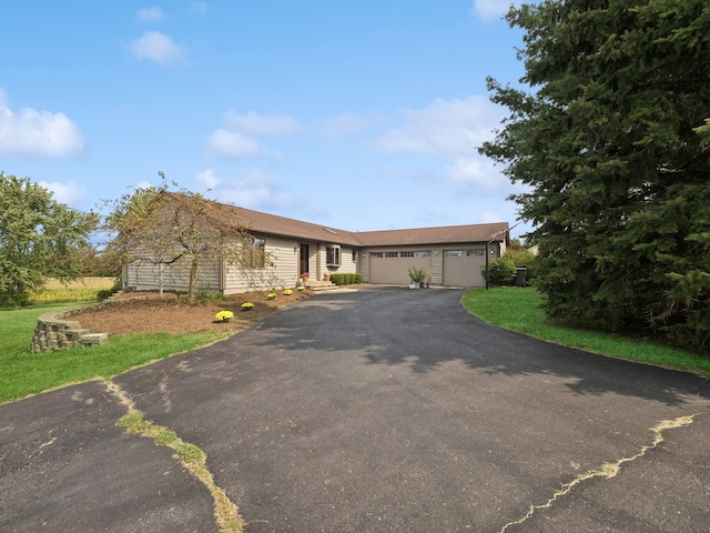 ranch-style home with a garage