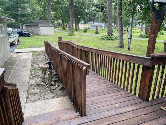 wooden terrace with a yard and a storage shed