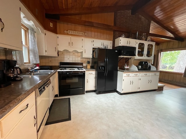 kitchen featuring sink, wooden ceiling, beamed ceiling, white cabinets, and black appliances