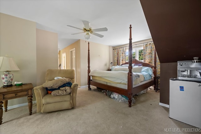 bedroom with ceiling fan and light carpet