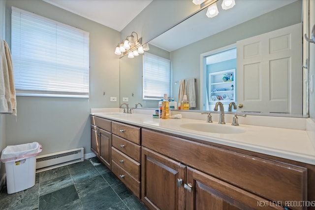 bathroom with vanity and baseboard heating