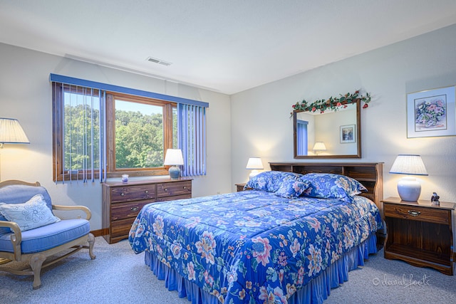 bedroom with light colored carpet