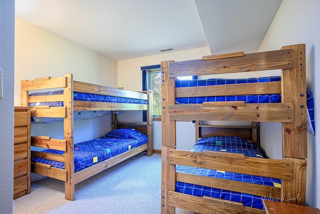 carpeted bedroom with visible vents