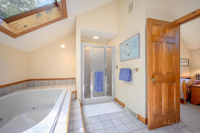 bathroom with visible vents, ensuite bath, a shower stall, lofted ceiling with skylight, and a jetted tub