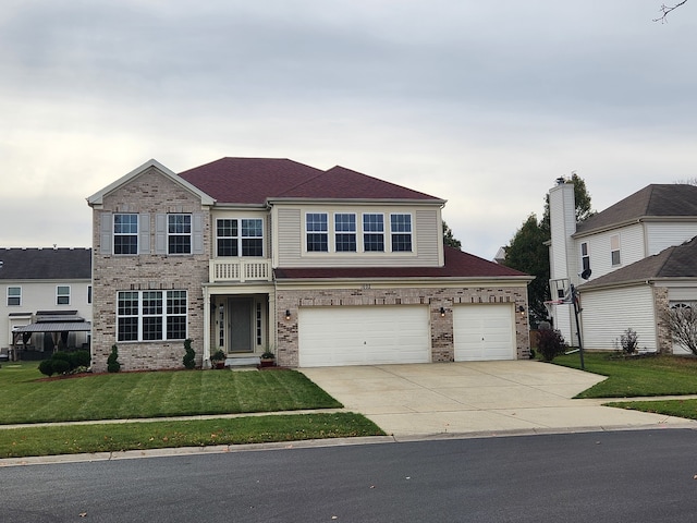 view of front facade with a garage and a front yard