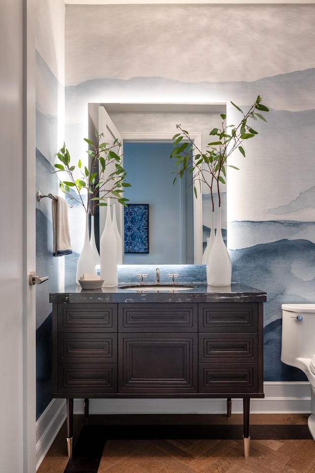 bathroom with vanity and toilet