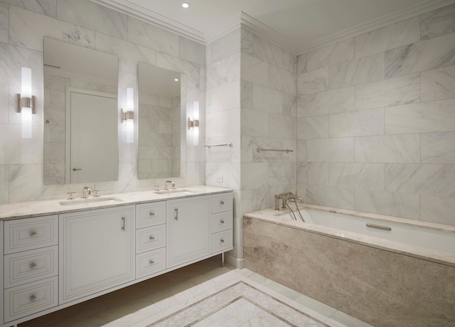 bathroom with crown molding, a relaxing tiled tub, tile walls, and vanity